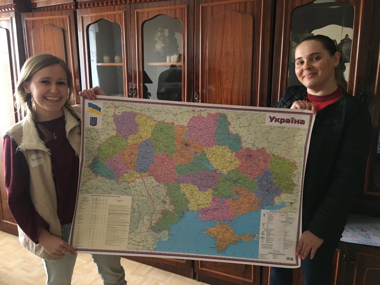 Whitney Cravens (left), who served with the U.S. Peace Corps in Ukraine, helps display a Ukrainian map.